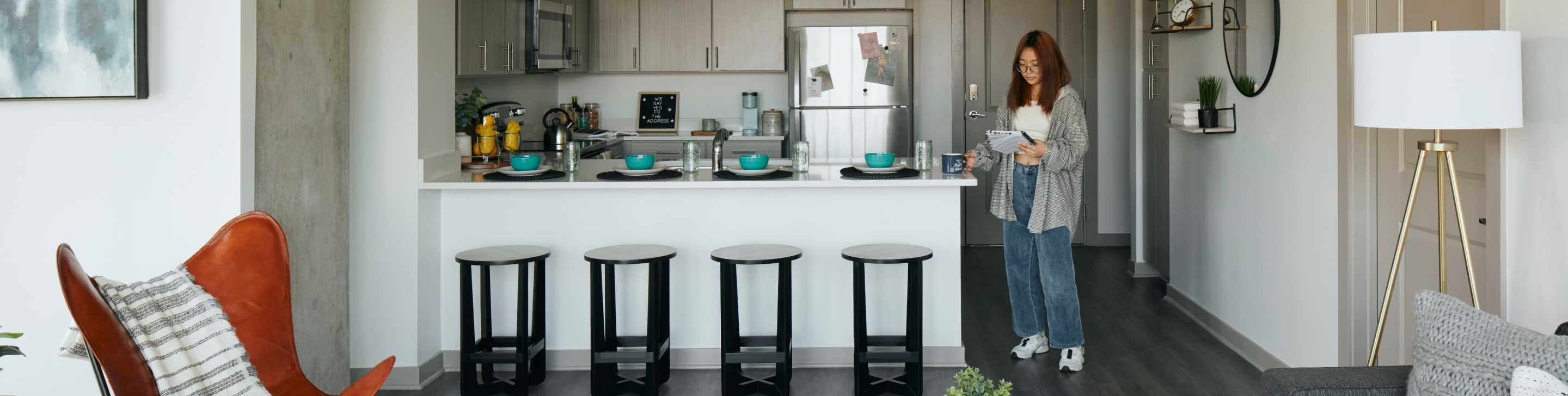 A woman standing in a kitchen