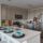 A woman standing in a kitchen