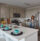 A woman standing in a kitchen