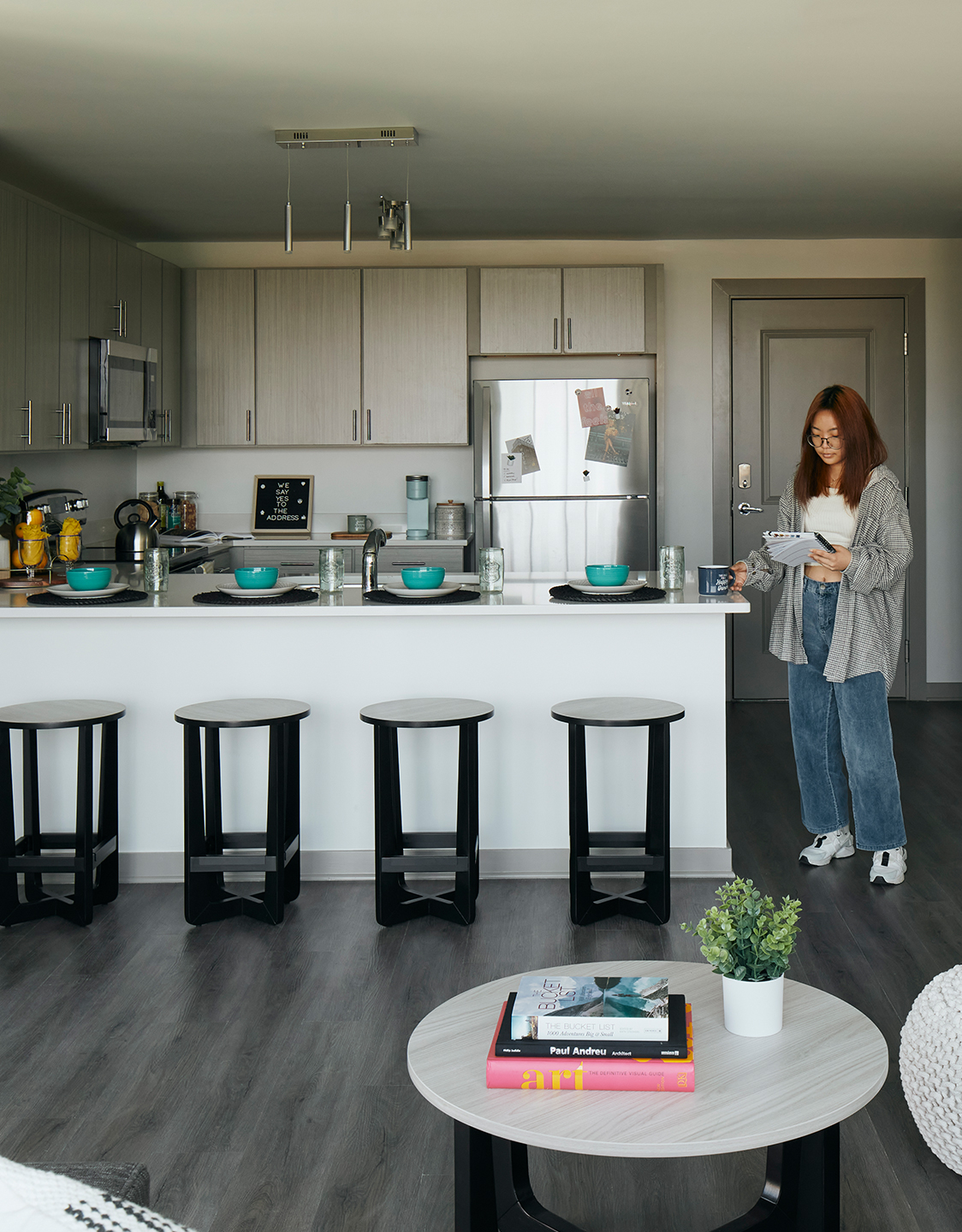 A woman standing in a kitchen