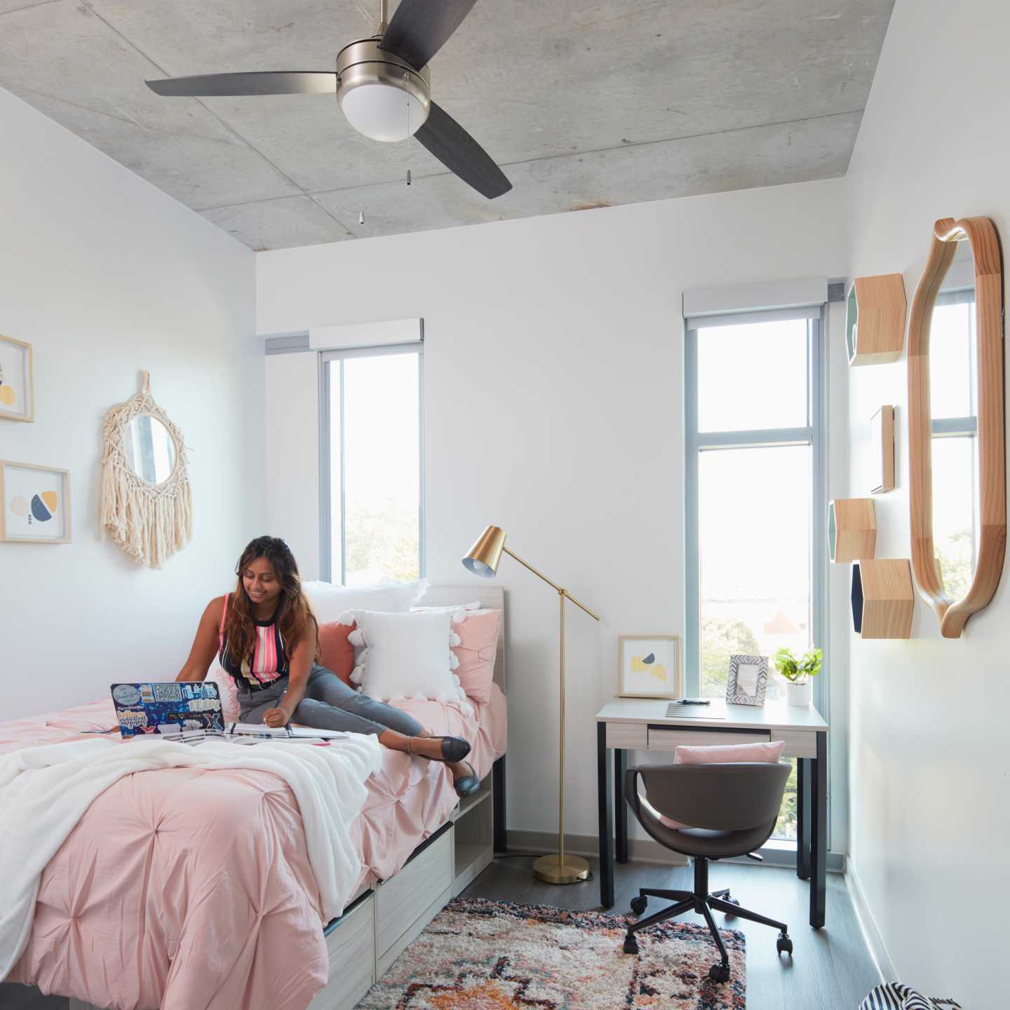 A woman sitting in her bedroom